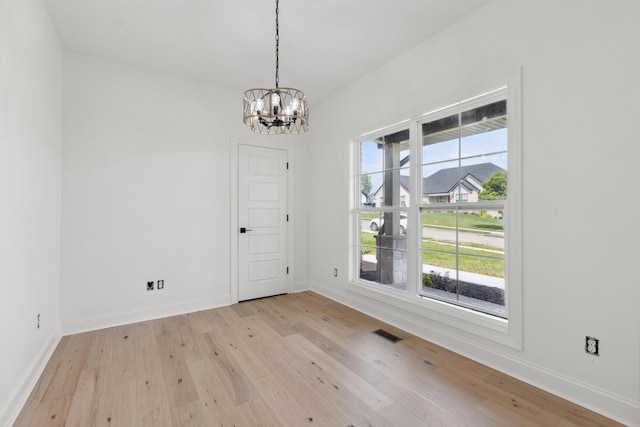 4252 Equestrian Way, Richmond, KY 40475 - unfurnished dining area featuring light wood finished floors and a chandelier