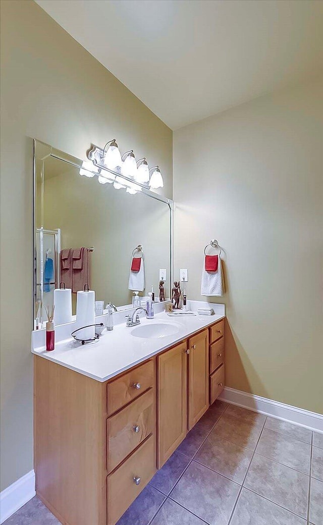 428 Shady Brook Dr, Richmond, KY 40475 - bathroom with double vanity, tile patterned floors, and baseboards