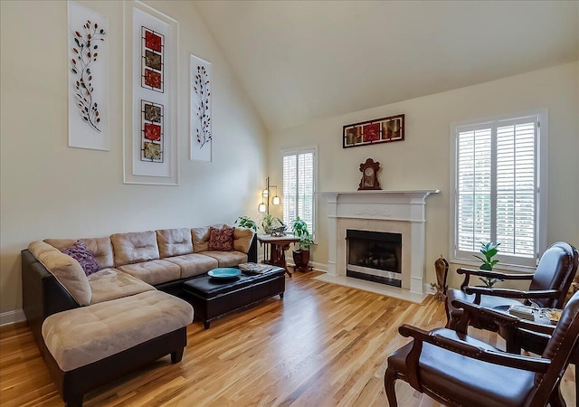 428 Shady Brook Dr, Richmond, KY 40475 - living room featuring light wood-style floors, a fireplace, high vaulted ceiling, and baseboards