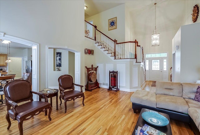 428 Shady Brook Dr, Richmond, KY 40475 - living area featuring a towering ceiling, light wood-type flooring, stairs, and baseboards