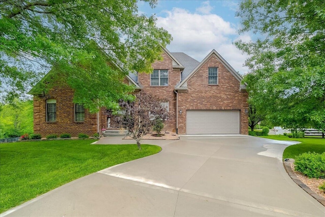 428 Shady Brook Dr, Richmond, KY 40475 - traditional-style house featuring a garage, concrete driveway, brick siding, and a front lawn