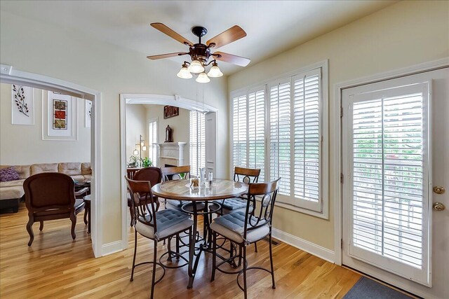 428 Shady Brook Dr, Richmond, KY 40475 - dining area featuring light wood finished floors, a ceiling fan, and baseboards