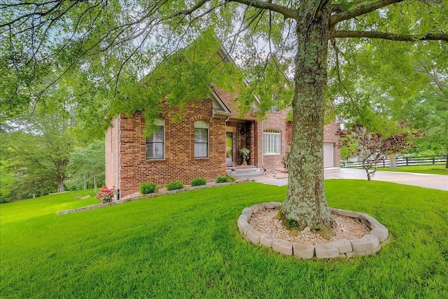 428 Shady Brook Dr, Richmond, KY 40475 - view of front facade featuring brick siding, a front yard, concrete driveway, and an attached garage