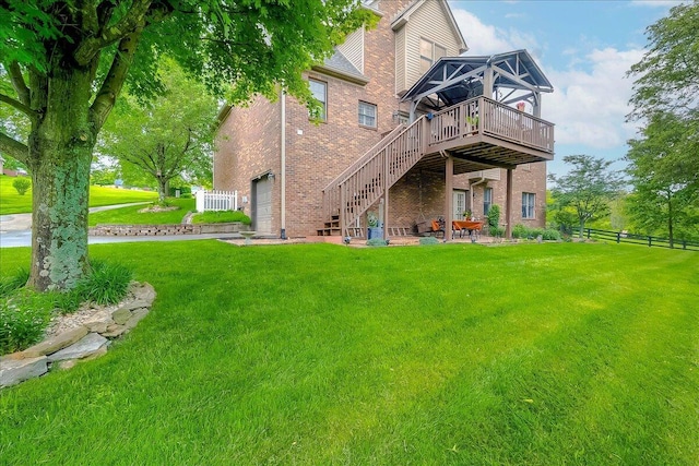 428 Shady Brook Dr, Richmond, KY 40475 - back of house with a deck, brick siding, stairs, a garage, and a patio