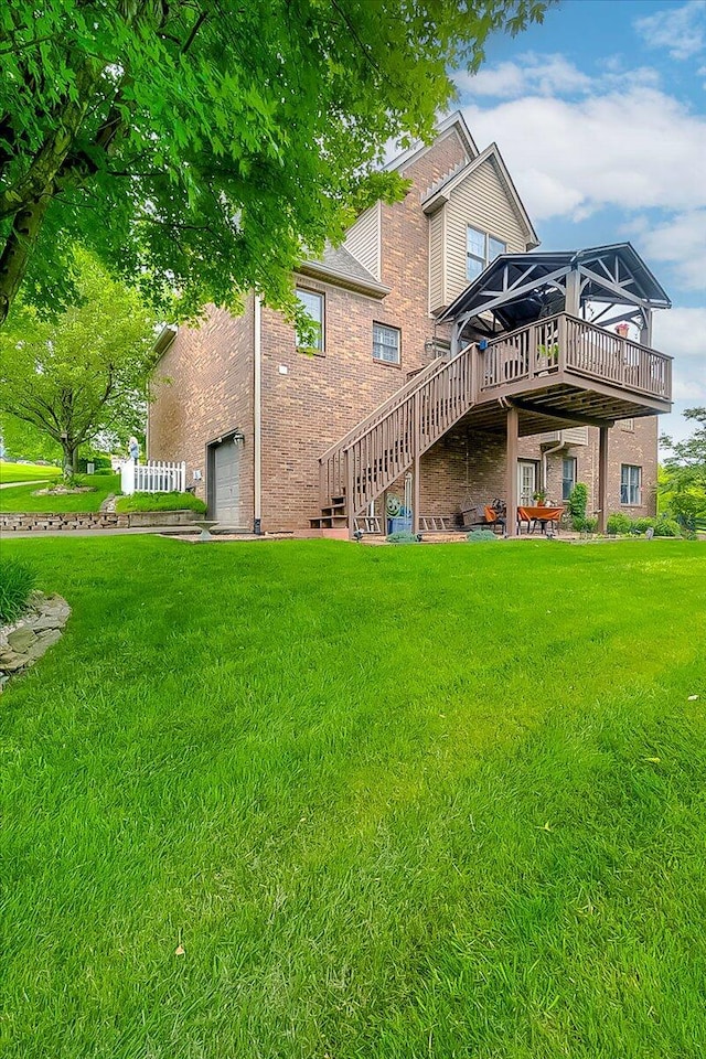 428 Shady Brook Dr, Richmond, KY 40475 - back of property with a wooden deck, stairs, brick siding, and a lawn