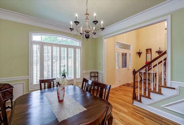 428 Shady Brook Dr, Richmond, KY 40475 - dining space with crown molding, a chandelier, stairs, plenty of natural light, and wood finished floors