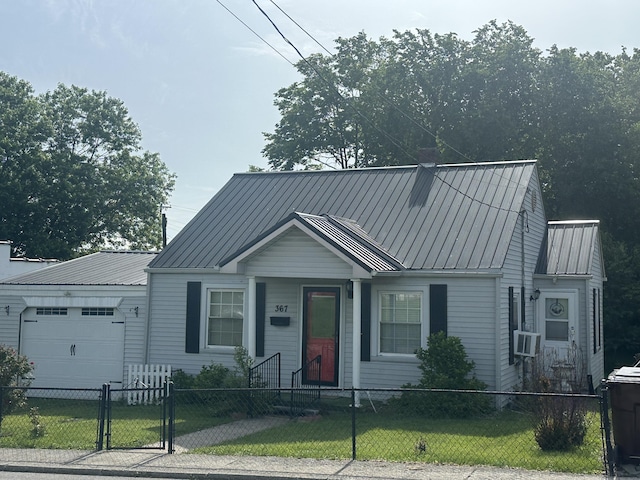 367 N N Estill Ave, Richmond, KY 40475 - view of front of home featuring a garage, a fenced front yard, metal roof, and cooling unit