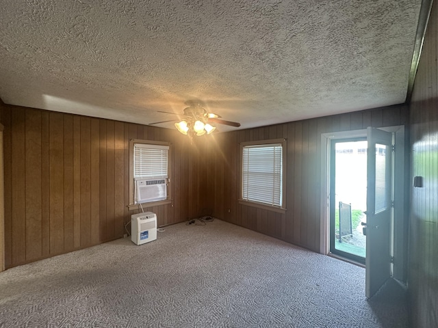 367 N N Estill Ave, Richmond, KY 40475 - unfurnished room featuring carpet flooring, a ceiling fan, wooden walls, and cooling unit