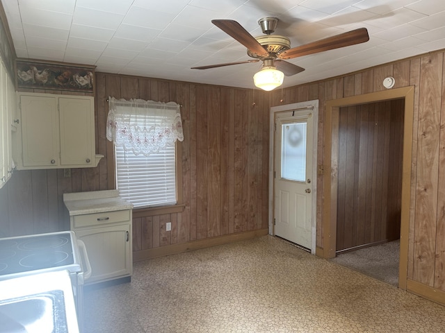 367 N N Estill Ave, Richmond, KY 40475 - kitchen featuring wood walls, ceiling fan, baseboards, light countertops, and light floors