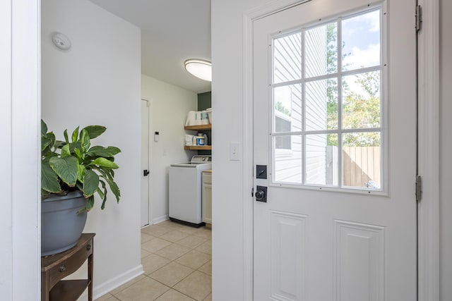 3657 Gladman Way, Lexington, KY 40503 - doorway featuring plenty of natural light, light tile patterned flooring, baseboards, and washer and clothes dryer
