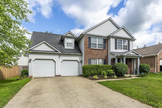 3657 Gladman Way, Lexington, KY 40503 - view of front facade featuring a garage, concrete driveway, brick siding, and roof with shingles