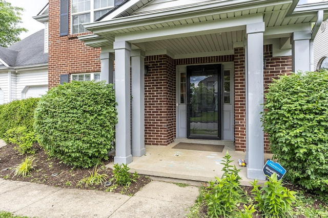 3657 Gladman Way, Lexington, KY 40503 - property entrance featuring brick siding, covered porch, and an attached garage