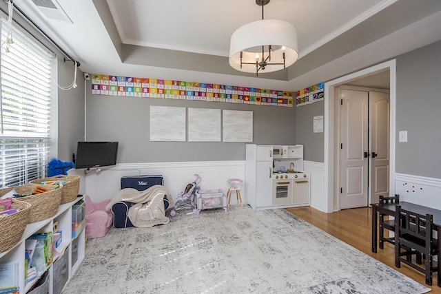 3657 Gladman Way, Lexington, KY 40503 - recreation room with wood finished floors, a wainscoted wall, and a chandelier