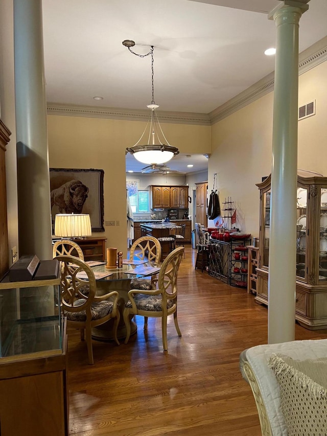 1740 Gose Pike, Danville, KY 40422 - dining room featuring ornate columns, ornamental molding, and dark wood-style flooring
