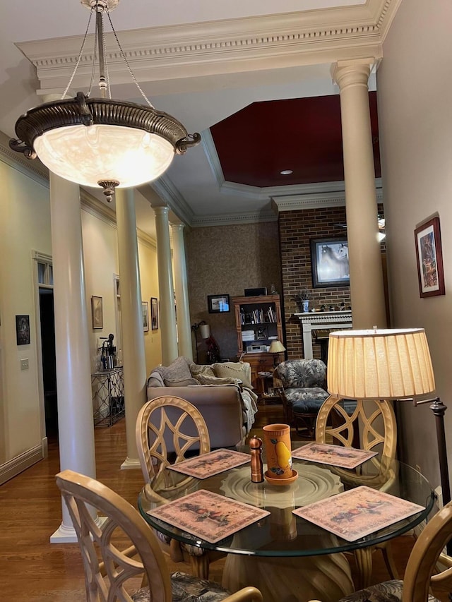 1740 Gose Pike, Danville, KY 40422 - dining area featuring ornate columns, ornamental molding, wood finished floors, and a tray ceiling