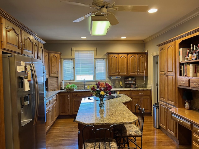 1740 Gose Pike, Danville, KY 40422 - kitchen with stainless steel fridge with ice dispenser, black electric stovetop, ceiling fan, ornamental molding, and a kitchen breakfast bar