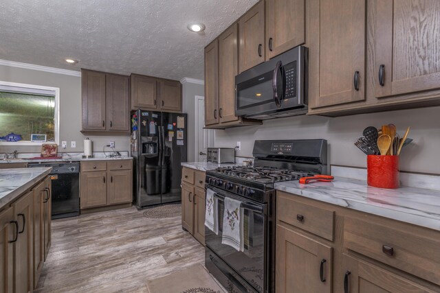 233 Bearskin Holw, Morehead, KY 40351 - kitchen with black appliances, crown molding, light wood-type flooring, light stone counters, and a textured ceiling
