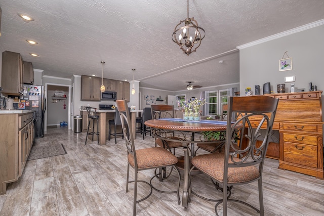233 Bearskin Holw, Morehead, KY 40351 - dining space with a textured ceiling, ornamental molding, light wood-style floors, a chandelier, and a ceiling fan