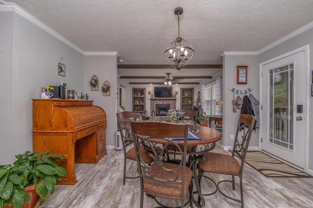 233 Bearskin Holw, Morehead, KY 40351 - dining space featuring light wood finished floors, a chandelier, a fireplace, ornamental molding, and ceiling fan