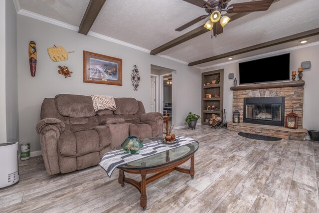 233 Bearskin Holw, Morehead, KY 40351 - living area with beamed ceiling, a ceiling fan, wood finished floors, a fireplace, and baseboards