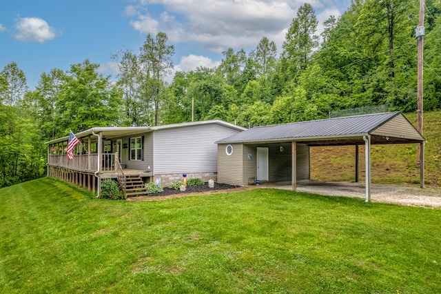 233 Bearskin Holw, Morehead, KY 40351 - back of house with a lawn, driveway, metal roof, an attached carport, and covered porch
