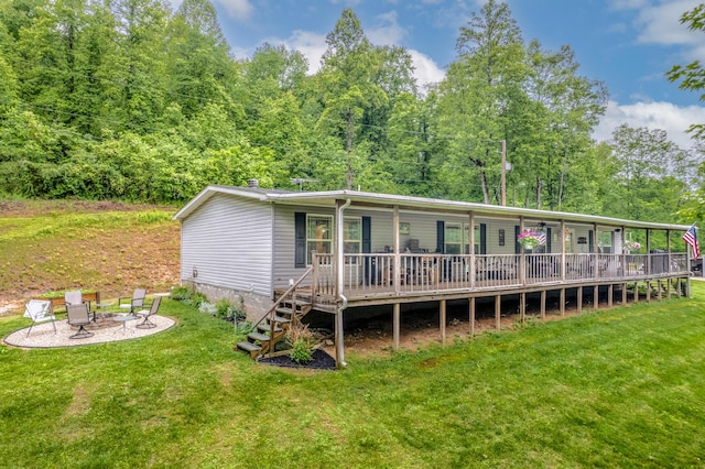233 Bearskin Holw, Morehead, KY 40351 - view of front facade featuring a fire pit, a front lawn, and a view of trees