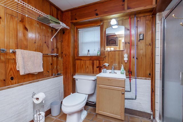274 Oster Dr, Harrodsburg, KY 40330 - full bath with an enclosed shower, vanity, toilet, wooden walls, and tile patterned floors