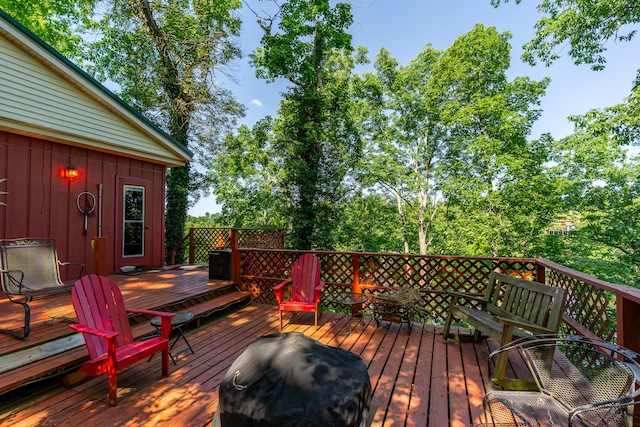 274 Oster Dr, Harrodsburg, KY 40330 - wooden deck with area for grilling and view of scattered trees