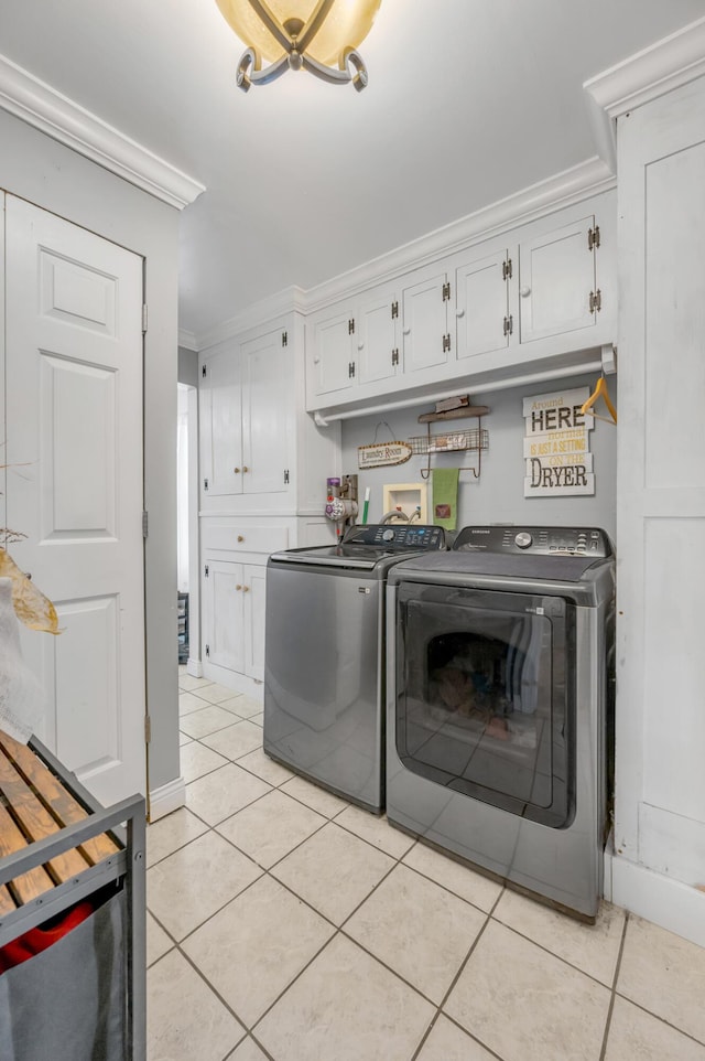 1235 Jackstown Rd, Paris, KY 40361 - laundry area featuring independent washer and dryer, cabinet space, crown molding, and light tile patterned floors