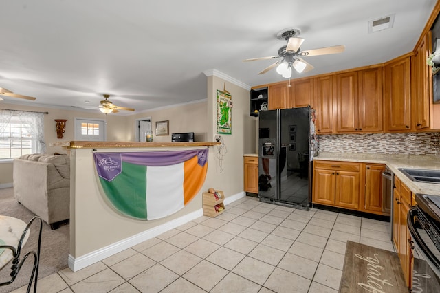 1235 Jackstown Rd, Paris, KY 40361 - kitchen featuring black fridge, a ceiling fan, light countertops, electric range oven, and crown molding
