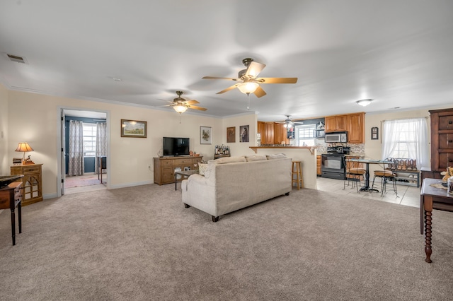 1235 Jackstown Rd, Paris, KY 40361 - living room with ceiling fan, light carpet, baseboards, and crown molding