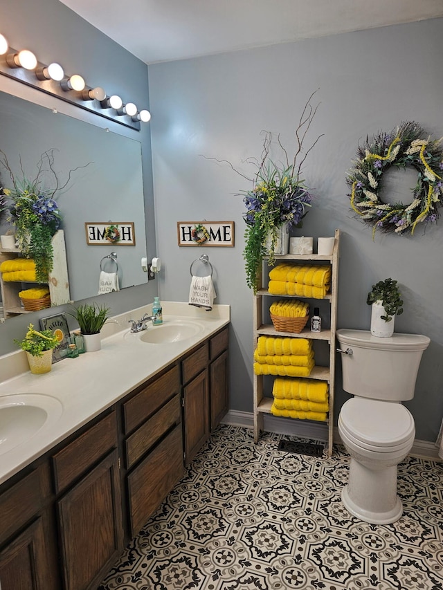 105 Herrington Hwy, Georgetown, KY 40324 - bathroom featuring double vanity, toilet, baseboards, and tile patterned flooring