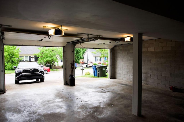 105 Herrington Hwy, Georgetown, KY 40324 - garage featuring a garage door opener and concrete block wall