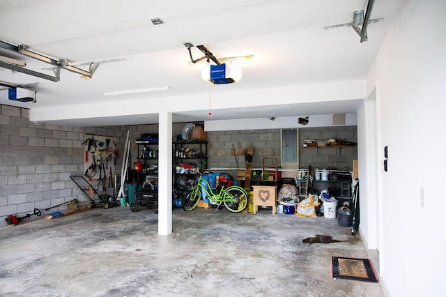 105 Herrington Hwy, Georgetown, KY 40324 - garage featuring a garage door opener, concrete block wall, and electric panel