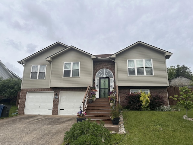 105 Herrington Hwy, Georgetown, KY 40324 - bi-level home featuring brick siding, an attached garage, asphalt driveway, and a front lawn