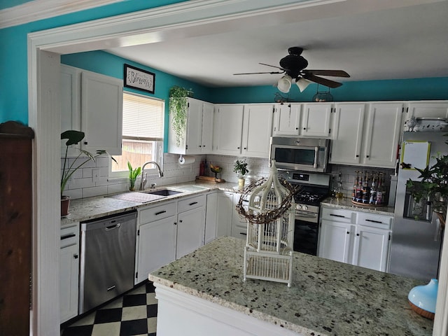 105 Herrington Hwy, Georgetown, KY 40324 - kitchen with appliances with stainless steel finishes, white cabinets, a sink, tile patterned floors, and ceiling fan