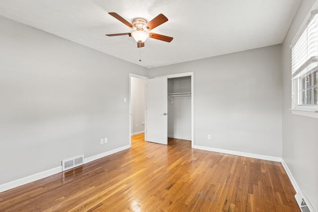 2371 Pierson Dr, Lexington, KY 40505 - unfurnished bedroom with a closet, light wood finished floors, baseboards, and ceiling fan