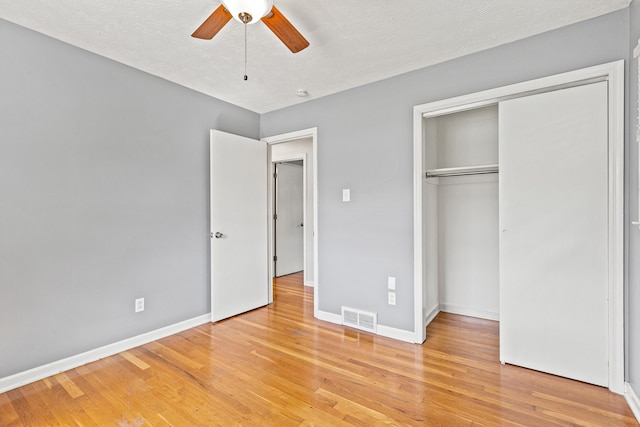 2371 Pierson Dr, Lexington, KY 40505 - unfurnished bedroom with light wood-style floors, baseboards, a closet, and a ceiling fan