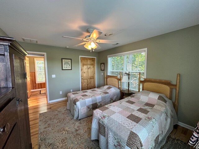 169 Kennedy Ln, Lancaster, KY 40444 - bedroom with light wood-type flooring, baseboards, multiple windows, and ceiling fan