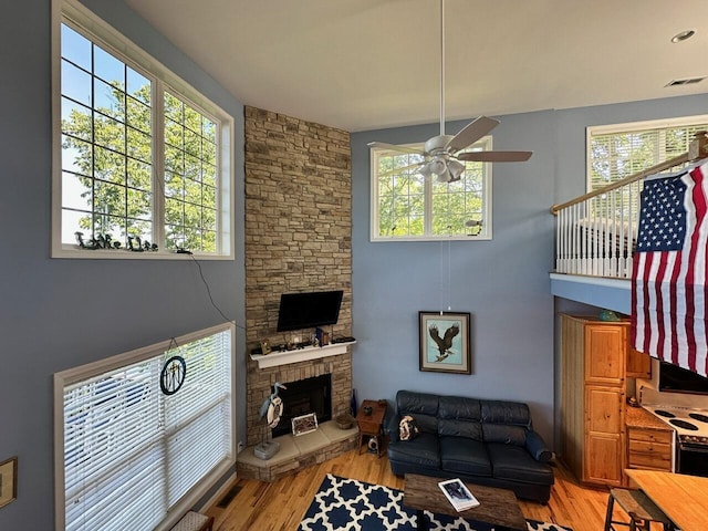 169 Kennedy Ln, Lancaster, KY 40444 - living area featuring ceiling fan, light wood-style floors, and a fireplace