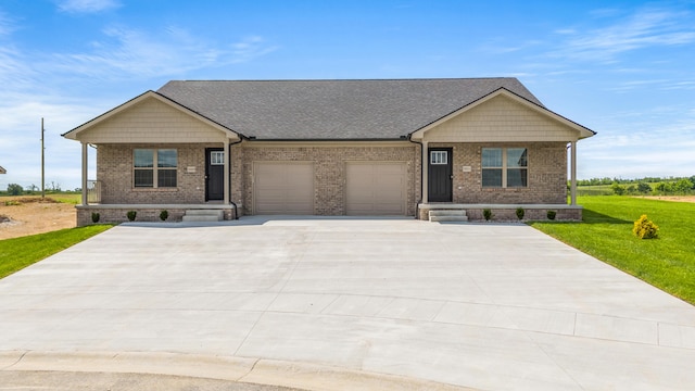 5001/5003 Melana Way, Richmond, KY 40475 - craftsman inspired home with a porch, an attached garage, and brick siding