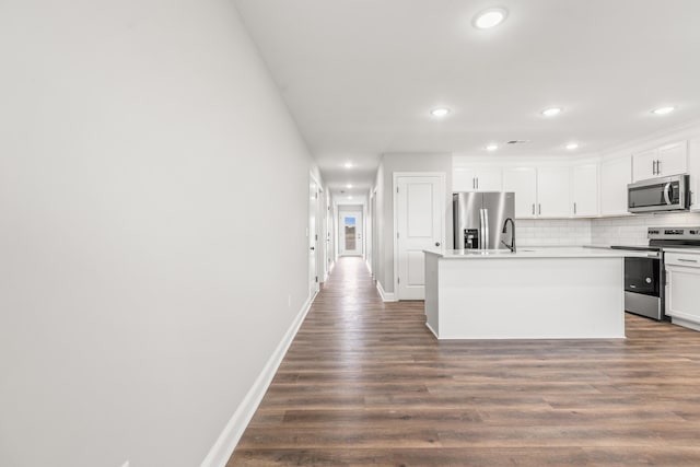 5001/5003 Melana Way, Richmond, KY 40475 - kitchen with stainless steel appliances, dark wood-style floors, a kitchen island with sink, baseboards, and backsplash