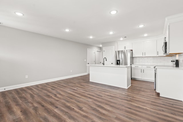5001/5003 Melana Way, Richmond, KY 40475 - kitchen featuring stainless steel appliances, dark wood-style flooring, recessed lighting, an island with sink, and white cabinetry