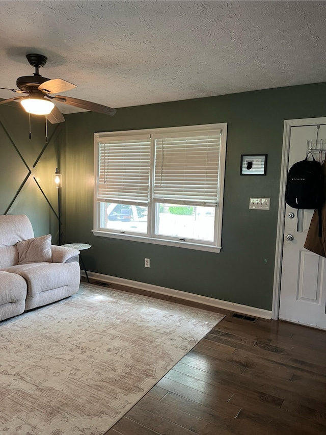 212 Winding Way, Wilmore, KY 40390 - living room featuring wood-type flooring, plenty of natural light, a textured ceiling, a ceiling fan, and baseboards