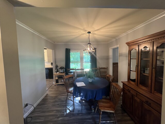 122 Mac Ct, Harrodsburg, KY 40330 - dining area featuring dark wood-type flooring, a chandelier, crown molding, and baseboards