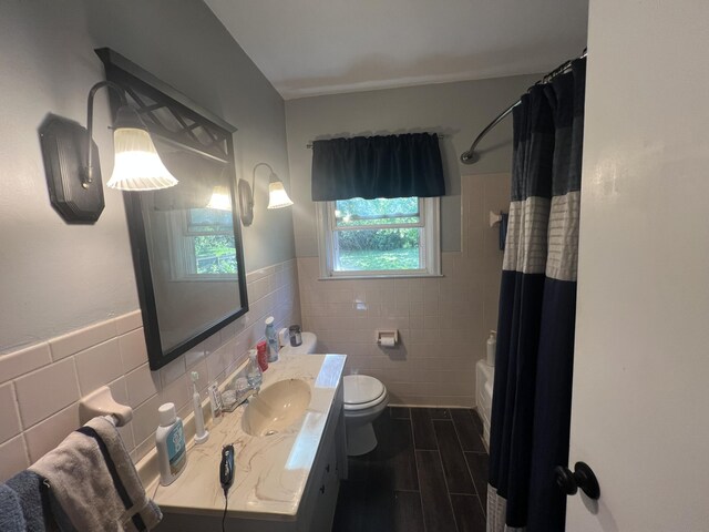 122 Mac Ct, Harrodsburg, KY 40330 - bathroom with tile walls, vanity, toilet, wood finished floors, and a wainscoted wall