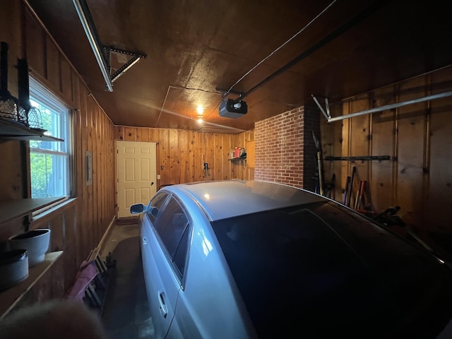 122 Mac Ct, Harrodsburg, KY 40330 - garage featuring wooden walls and a garage door opener