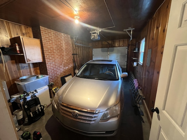 122 Mac Ct, Harrodsburg, KY 40330 - garage featuring wood walls and a garage door opener