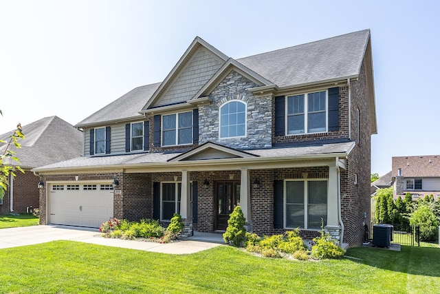 3880 Leighton Ln, Lexington, KY 40515 - craftsman-style home with covered porch, a front yard, brick siding, and driveway