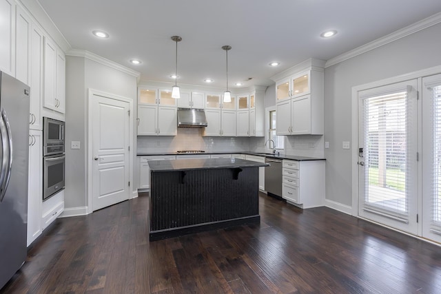 3880 Leighton Ln, Lexington, KY 40515 - kitchen with under cabinet range hood, appliances with stainless steel finishes, dark countertops, a kitchen island, and tasteful backsplash